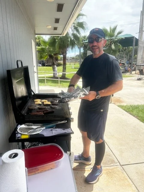 David Correia grilling burgers and hot dogs for Jupiter Hammerheads concessions at Jupiter Community Park