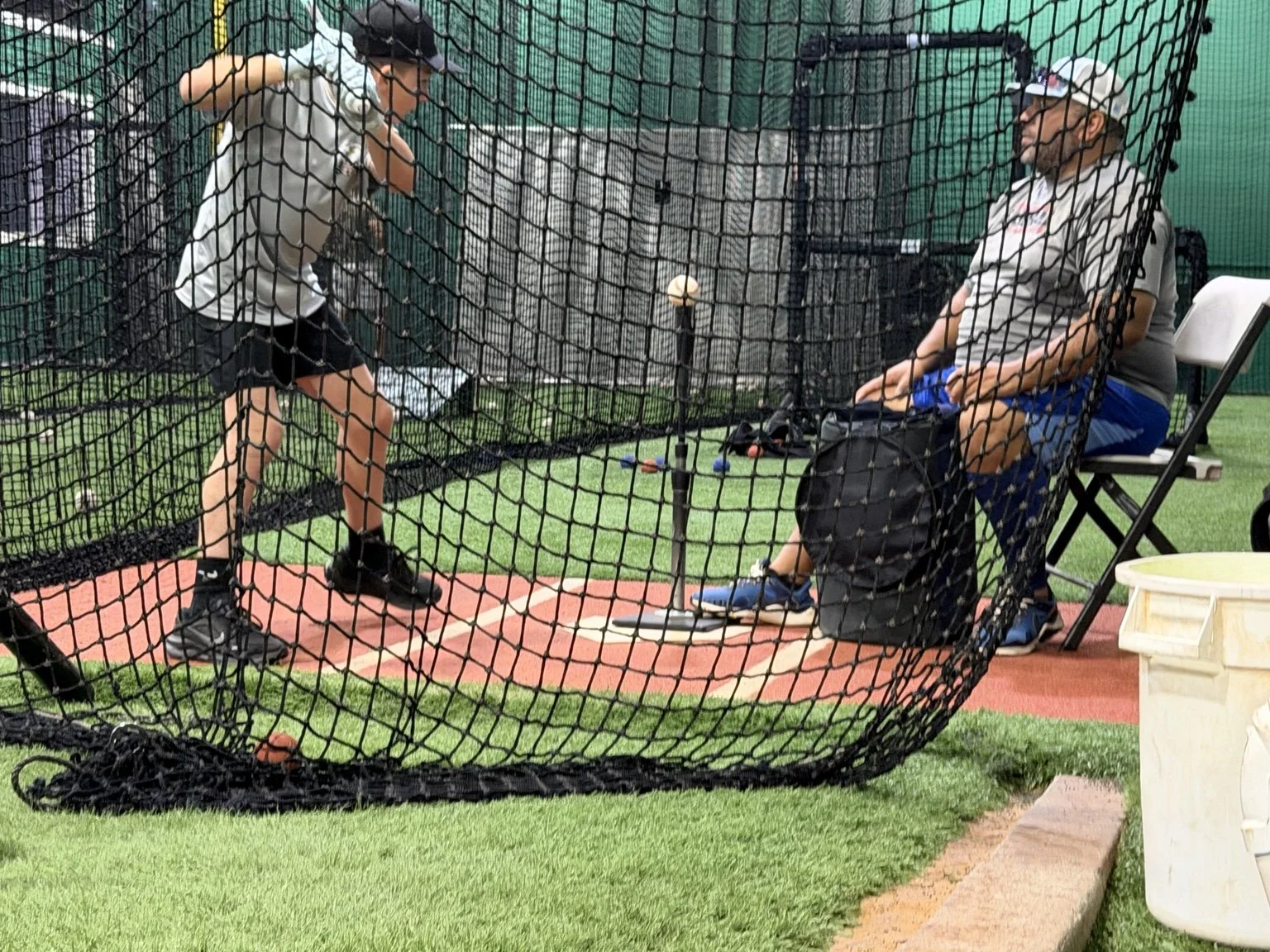 Freddy LaFleur training with Manny Olivera during a hitting lesson at Line Drive Indoor Batting in Jupiter.