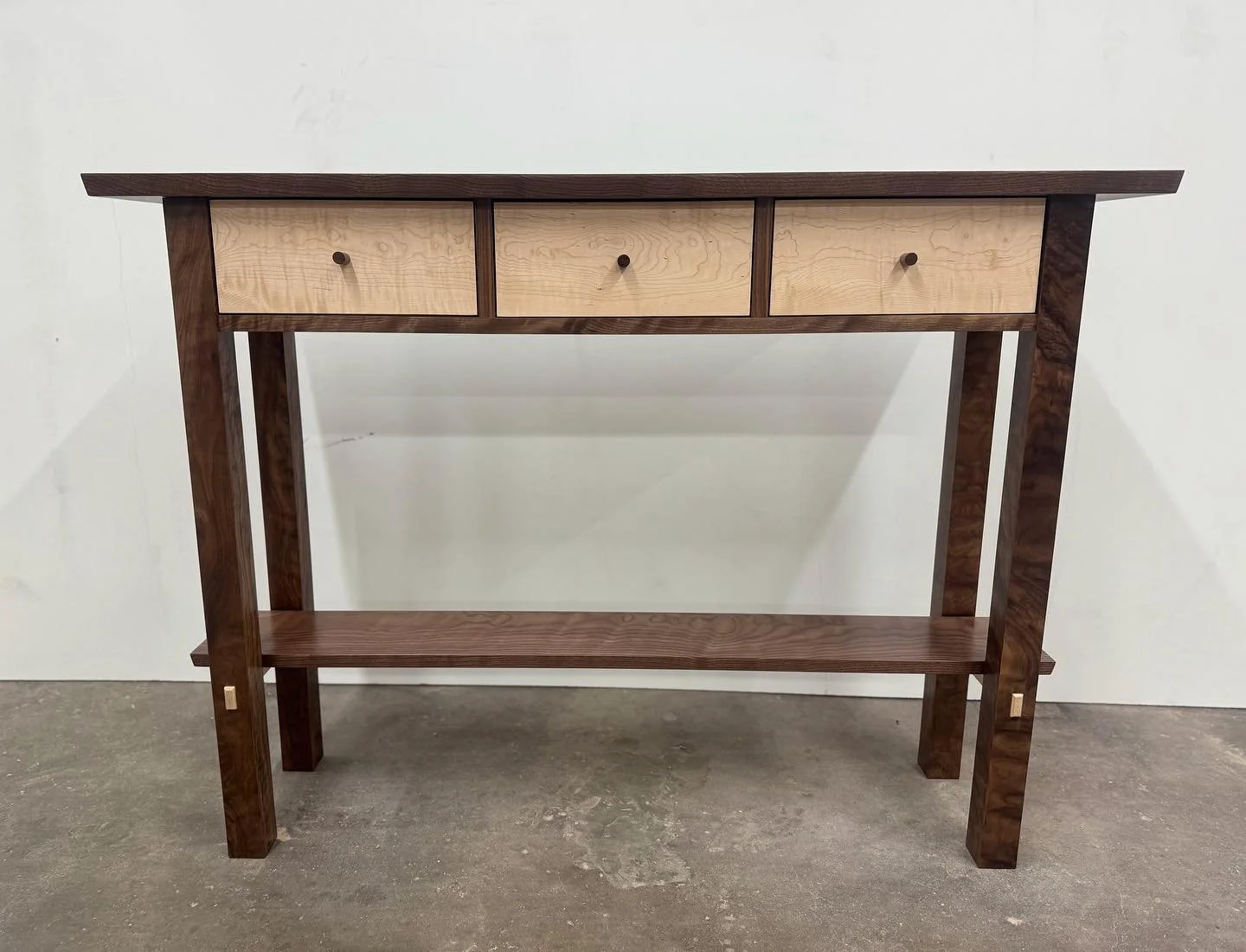 This table could be yours. It will be up for auction to benefit St Michaels school. It&rsquo;s a 3 drawer 48&rdquo; hall table. It is made from Curly Walnut and Maple. Mortise and tenon joinery with dovetail drawers.