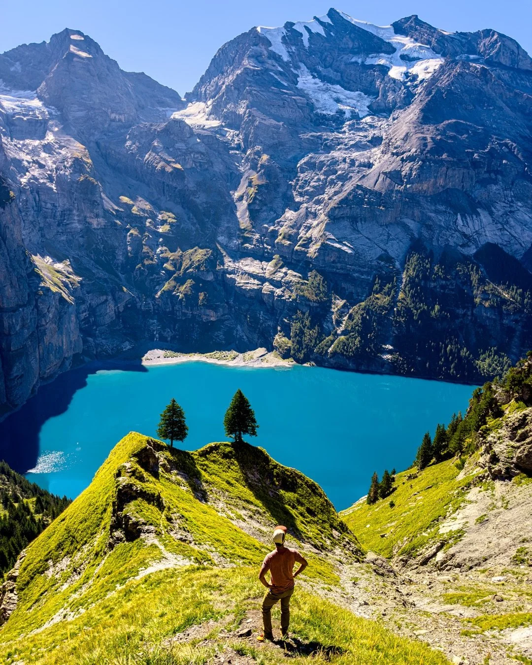 Yes, the water actually looks like that. 👀

Oeschinensee has the kind of blue that makes you question your camera settings.

The Panorama Trail climbs high above the lake, where tiny hikers along the path help put into perspective just how big the m