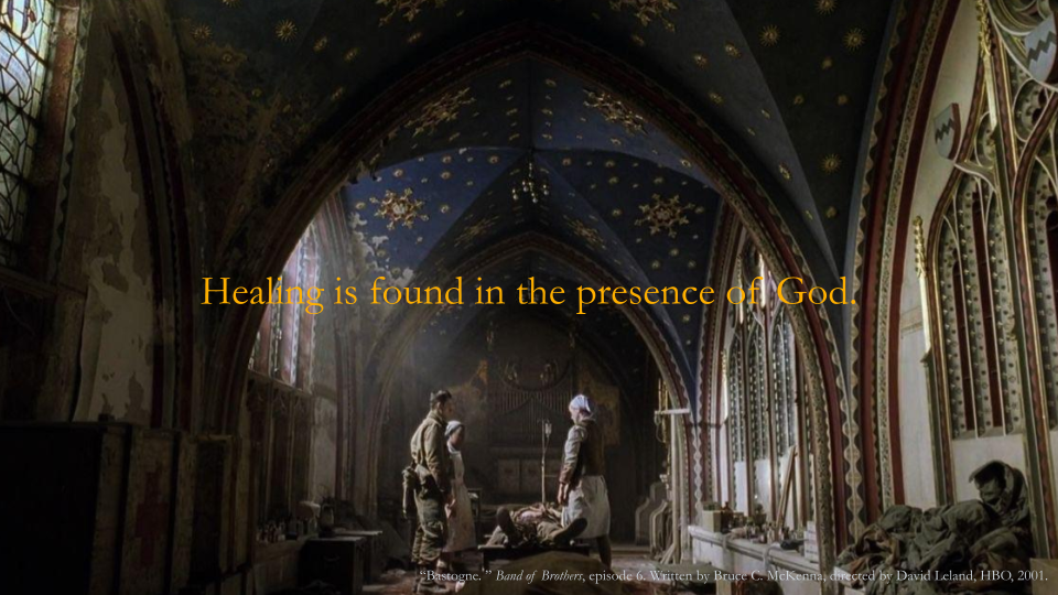 Interior of a historic church or cathedral with ornate gold and red detailing, stained glass windows, and a dark blue ceiling decorated with gold stars and snowflakes. Two women are standing near the altar, one on the left praying and the other on the right holding a white cloth, with a person lying on the floor between them.