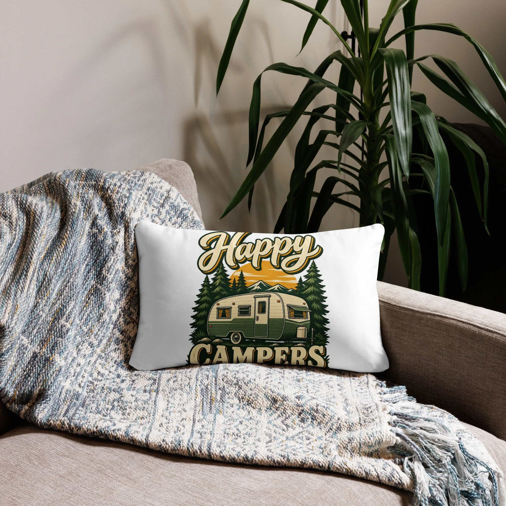 Happy Campers camping throw pillow with vintage green camper and sunset design, 20 by 12 inches, front view