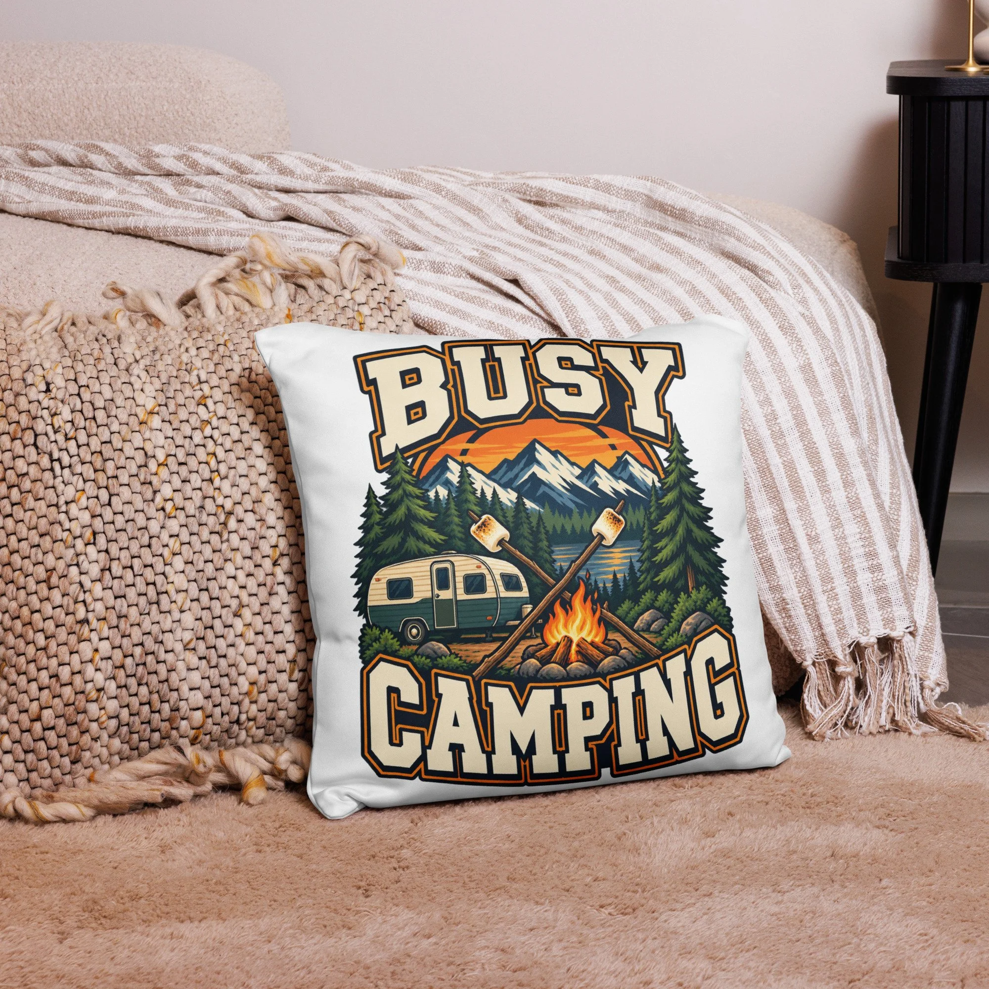 Busy Camping camping throw pillow with vintage camper, mountains and campfire design, 18 by 18 inches, front view