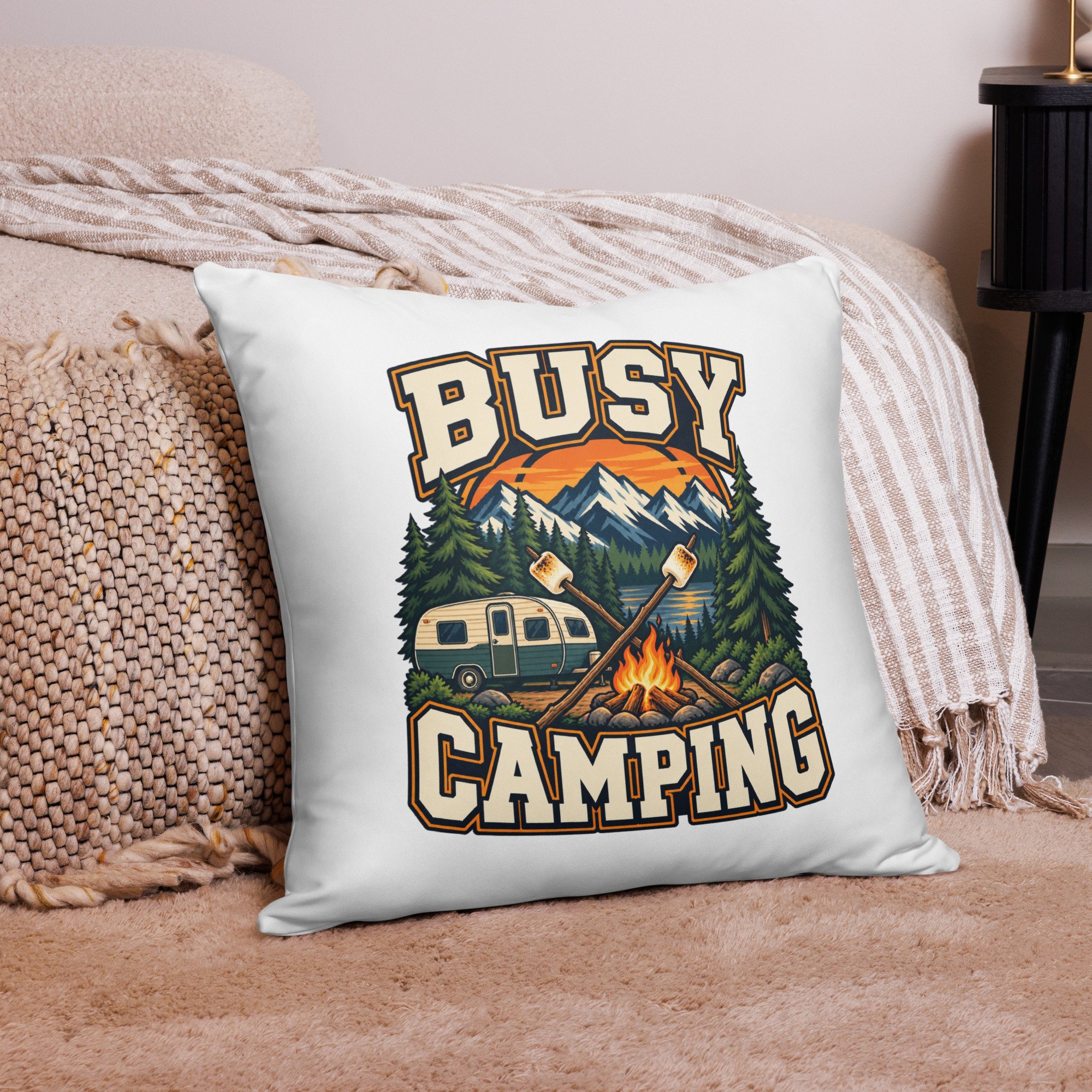 Busy Camping camping throw pillow with vintage camper, mountains and campfire design, 22 by 22 inches, front view