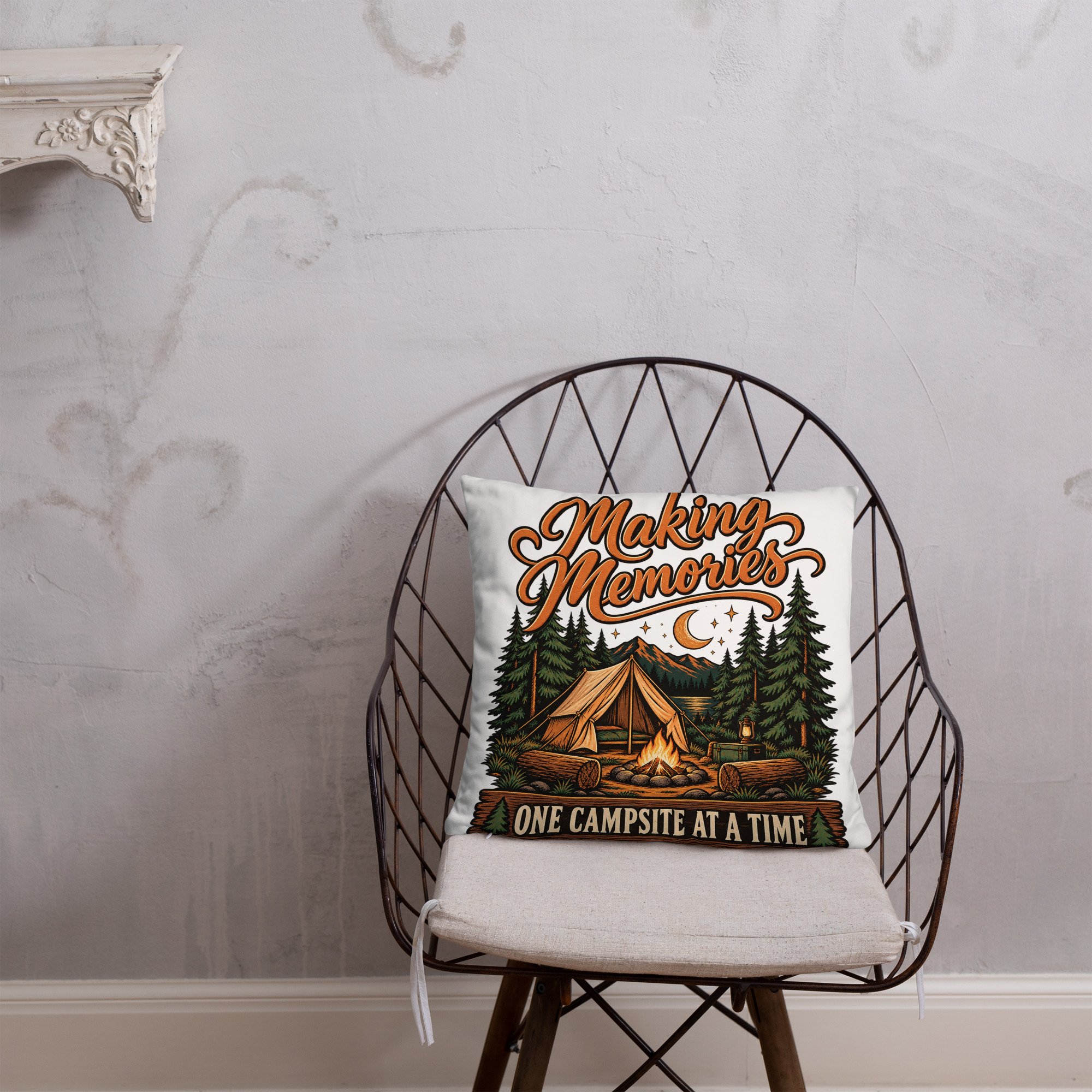 Making Memories camping throw pillow with tent and campfire design, 18 by 18 inches, front lifestyle view