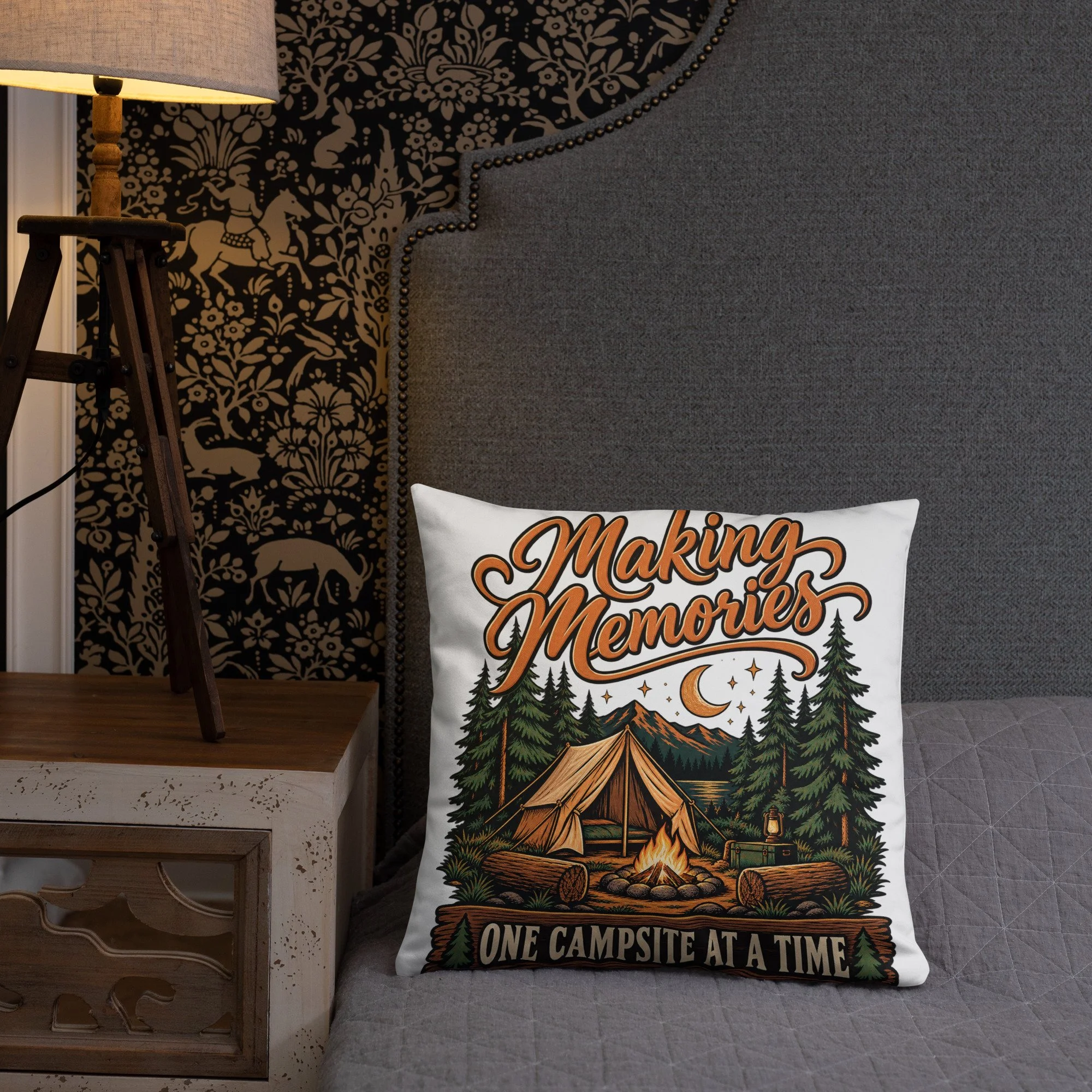 Making Memories camping throw pillow with tent and campfire design, 18 by 18 inches, front lifestyle view