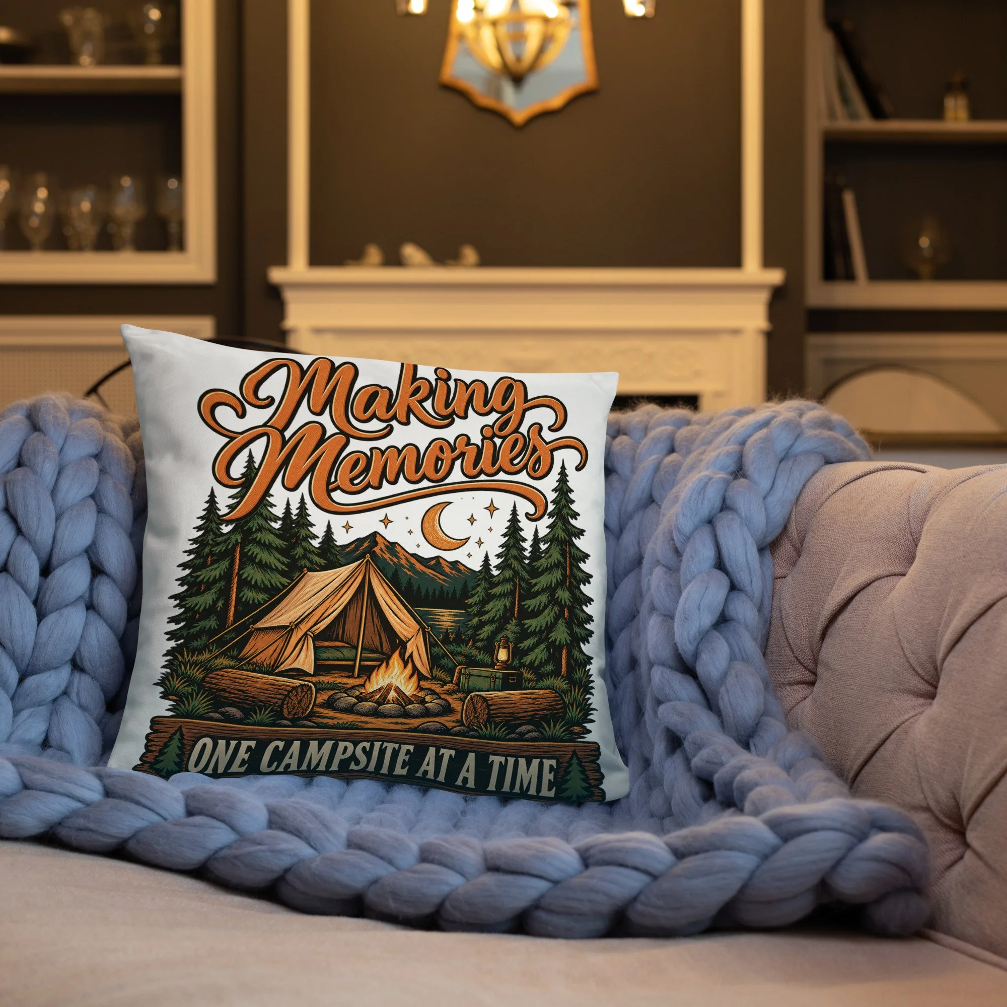 Making Memories camping throw pillow with tent and campfire design, 18 by 18 inches, front lifestyle view