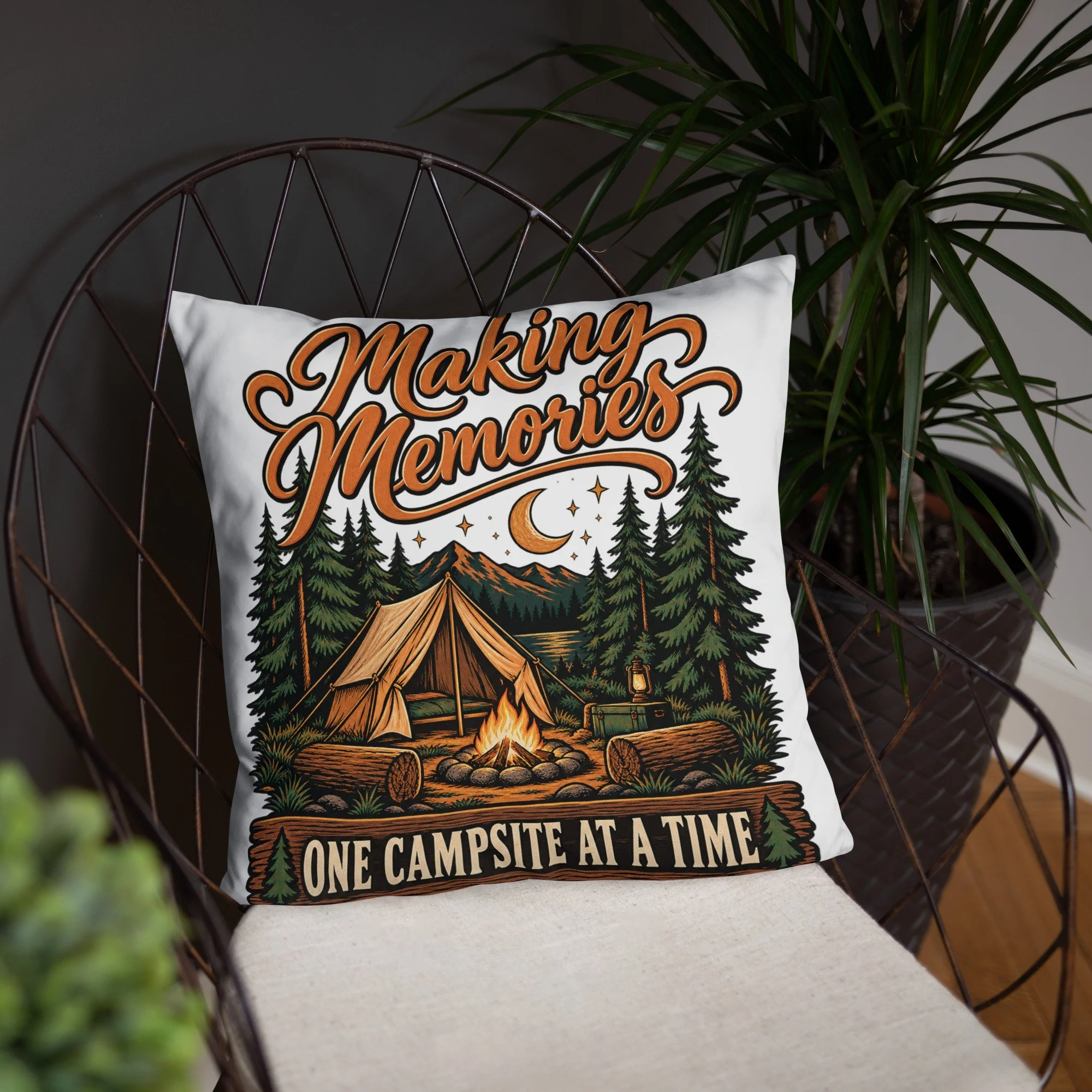 Making Memories camping throw pillow with tent and campfire design, 18 by 18 inches, front lifestyle view