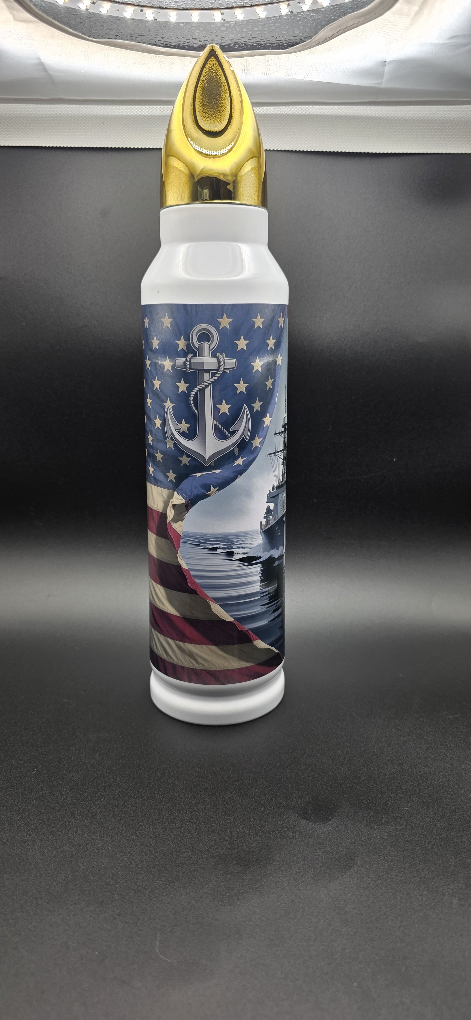Full view of a personalized U.S. Navy bullet-style tumbler featuring an anchor, American flag, and naval warship design.