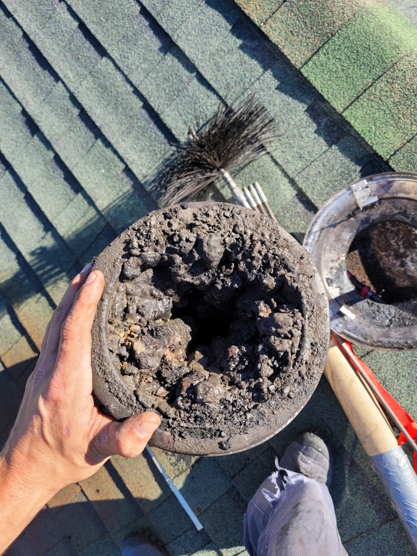an extremely clogged wood stove flue pipe.