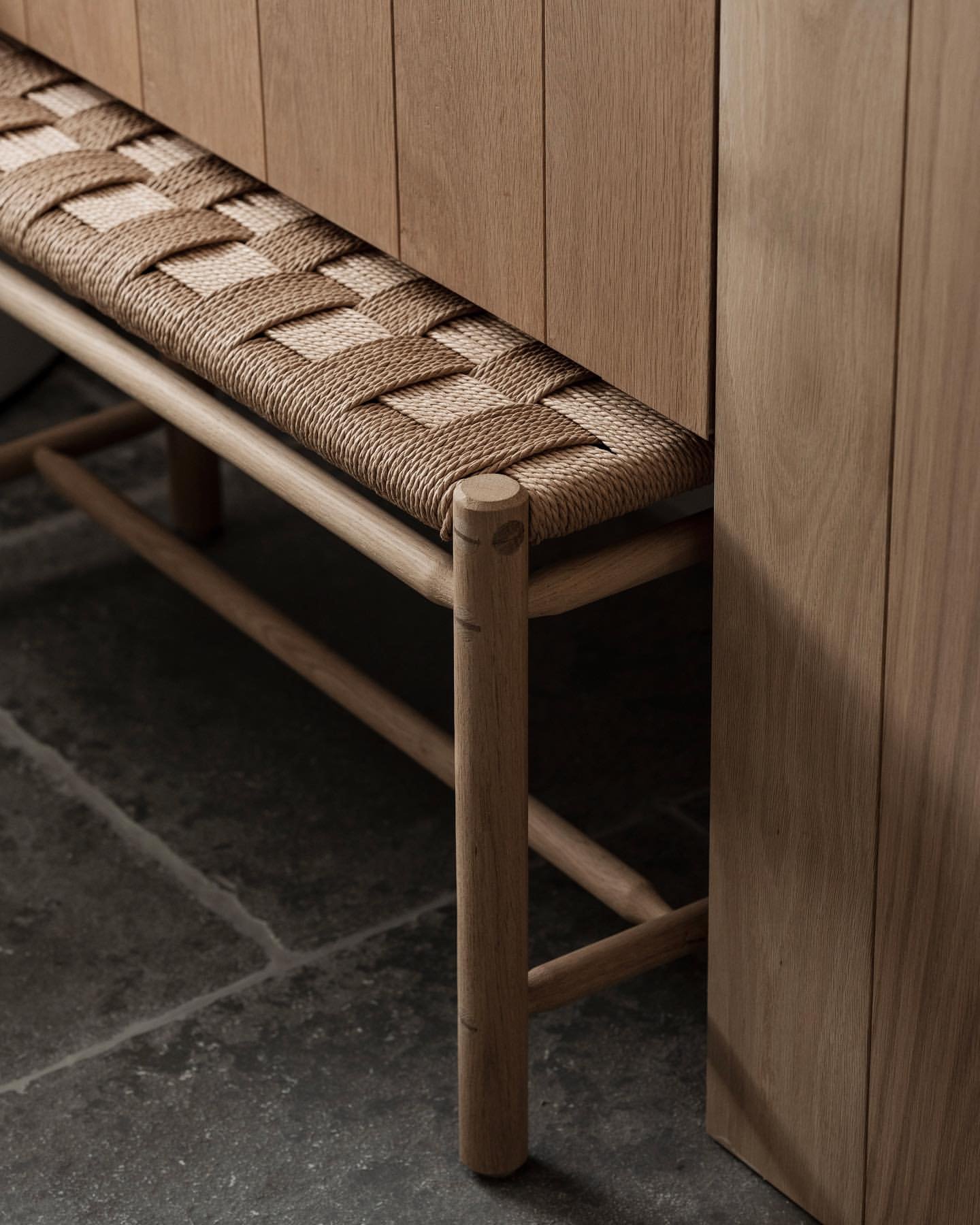 Image of bathroom room with weaved oak stool under a vanity