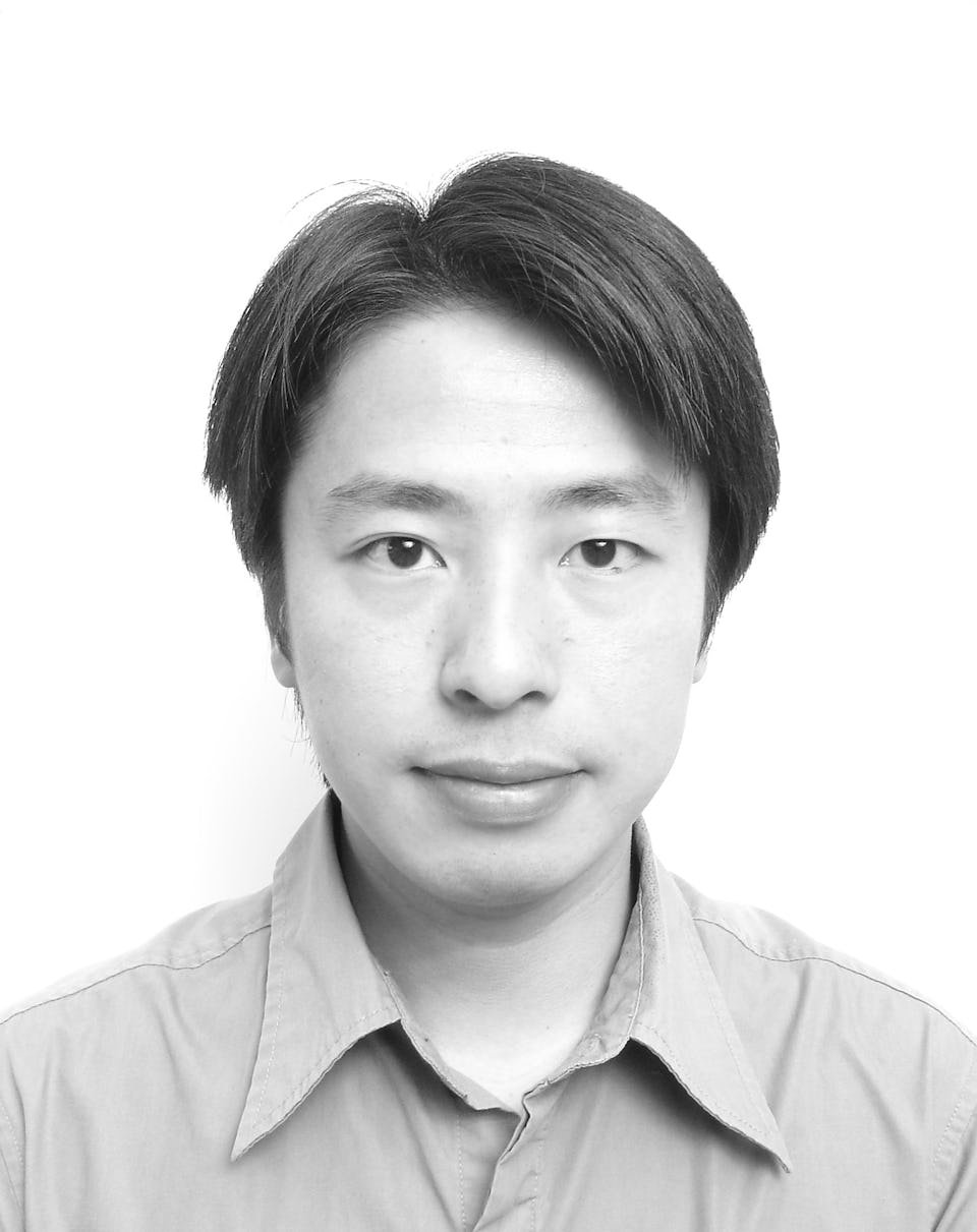 Black and white portrait of an Asian man with straight hair, wearing a collared shirt, looking at the camera with a neutral expression.