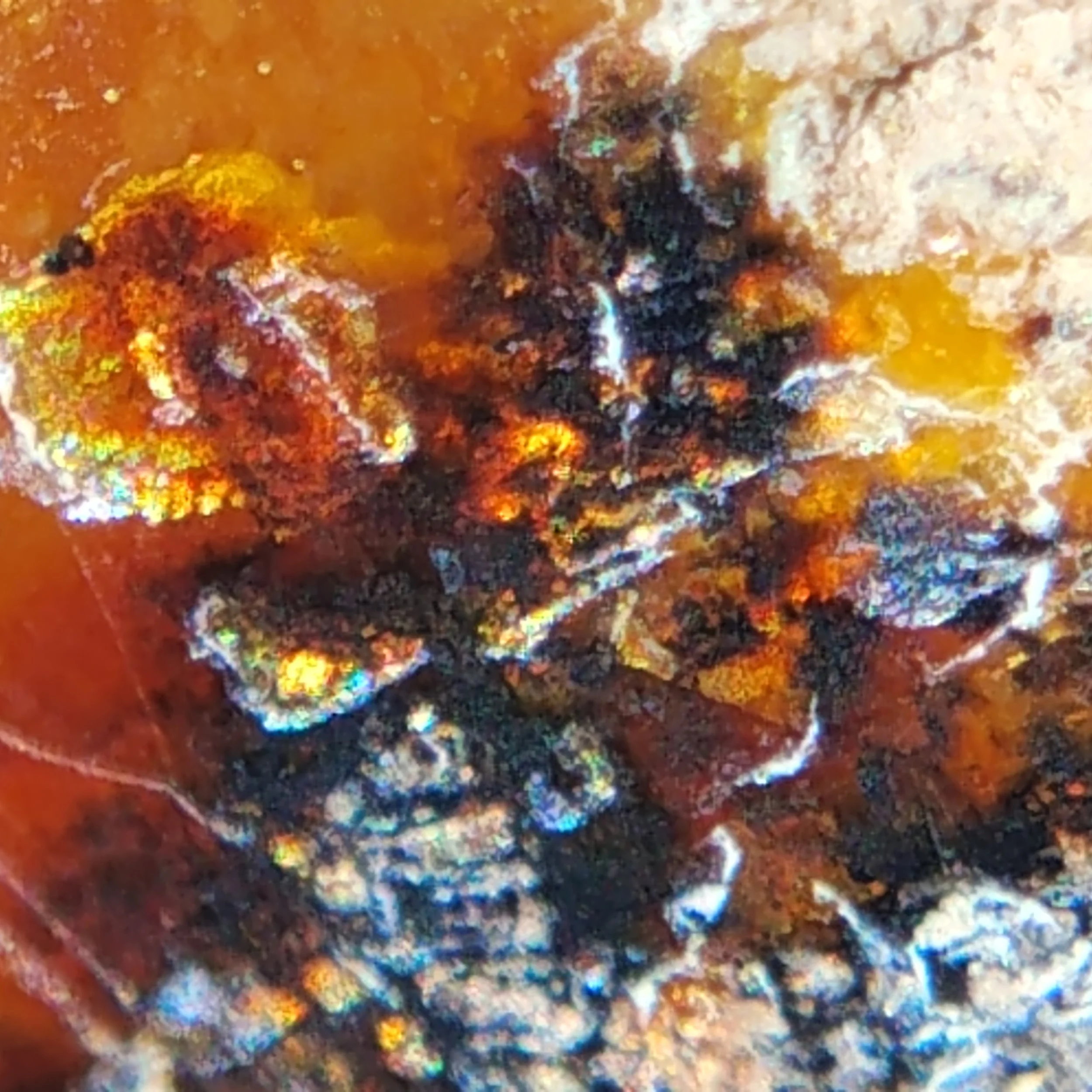 A piece of the opal that has native metallic inclusions, giving it that flash of fire.