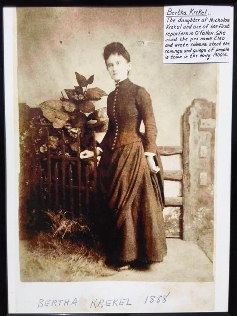 Bertha Krekel, the daughter of Nicholas Kernel and one of the first reporters in O'Fallon. She used the pen name 'Cleo' and wrote columns about the comings and goings of people in town in the early 1900's.