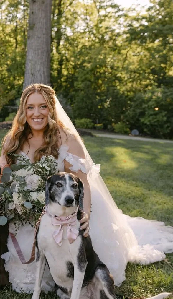 photo of Kat, stylist, in her wedding dress and with her dog