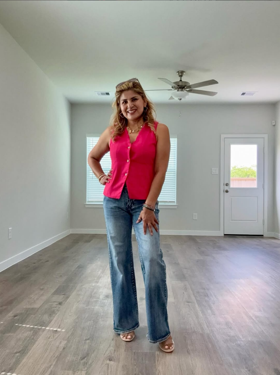 Realtor Aide Bueno inside a residential property
