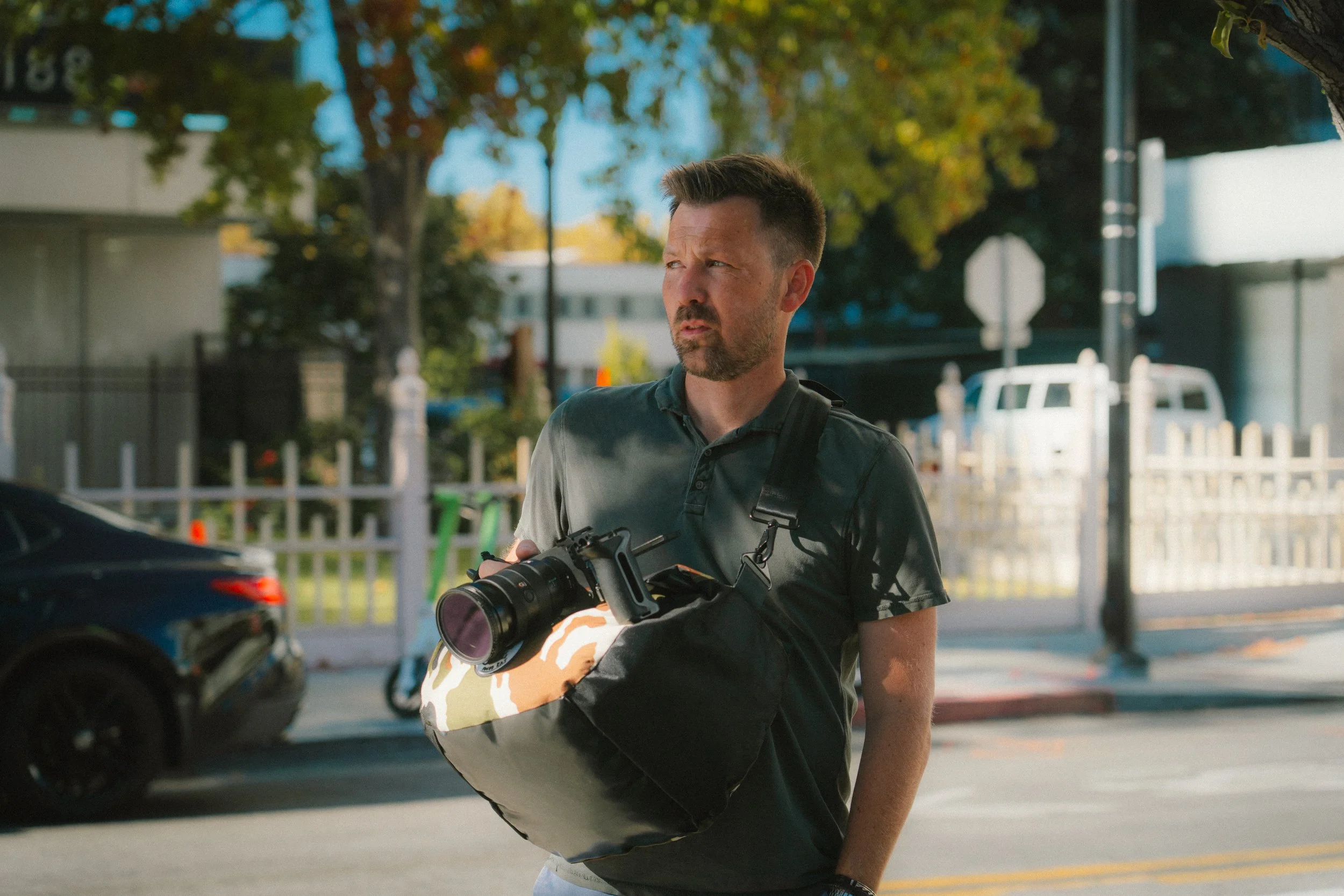 Gary Magill carrying camera gear on a shoot in the Bay Area