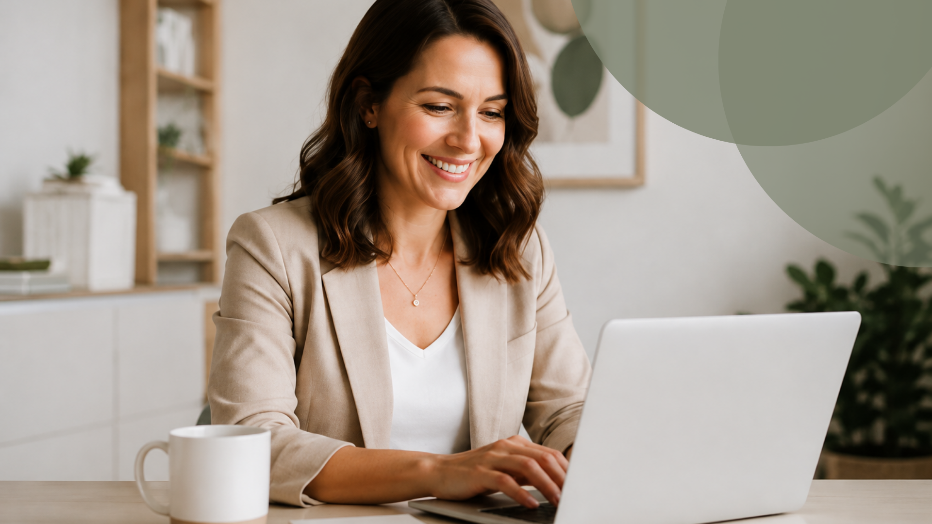 Lady sat in front of her laptop, smiling as she works