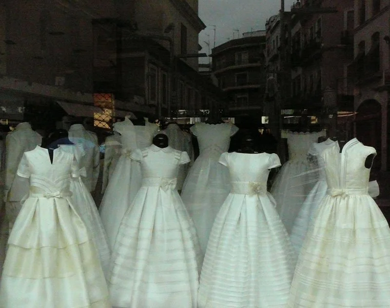 COMMUNION ... What will the group of gathered and headless communion dresses do next, as they mill around in the street?

A story has suspense, surprise and dénouement. A chance encounter, a happy accident, a twist of plot. The stories in these image
