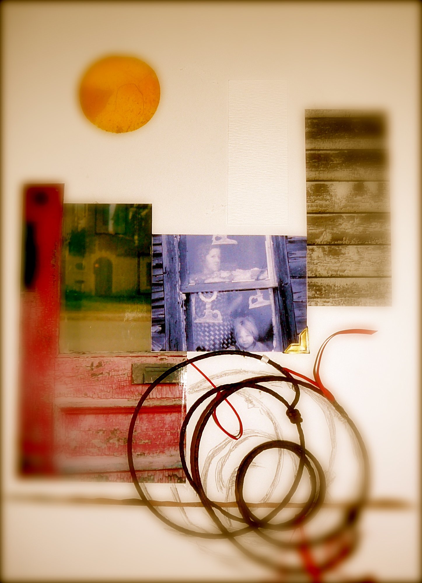 A collection of photos, a yellow circle, and wires on a white surface.