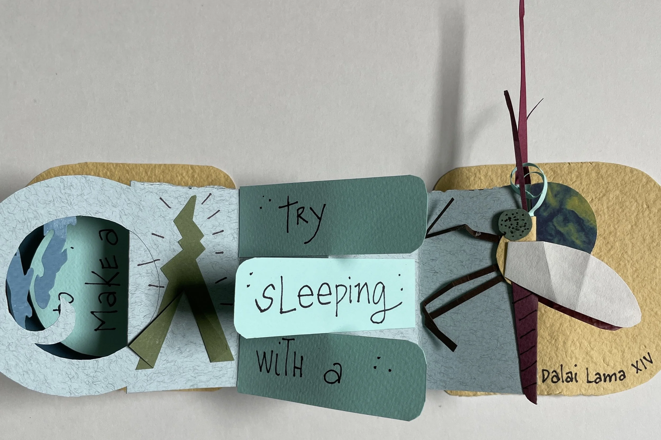 Collage with various cutouts of Earth, a lightning bolt, a heart, trees, and labels with handwritten text, including a note about sleeping.