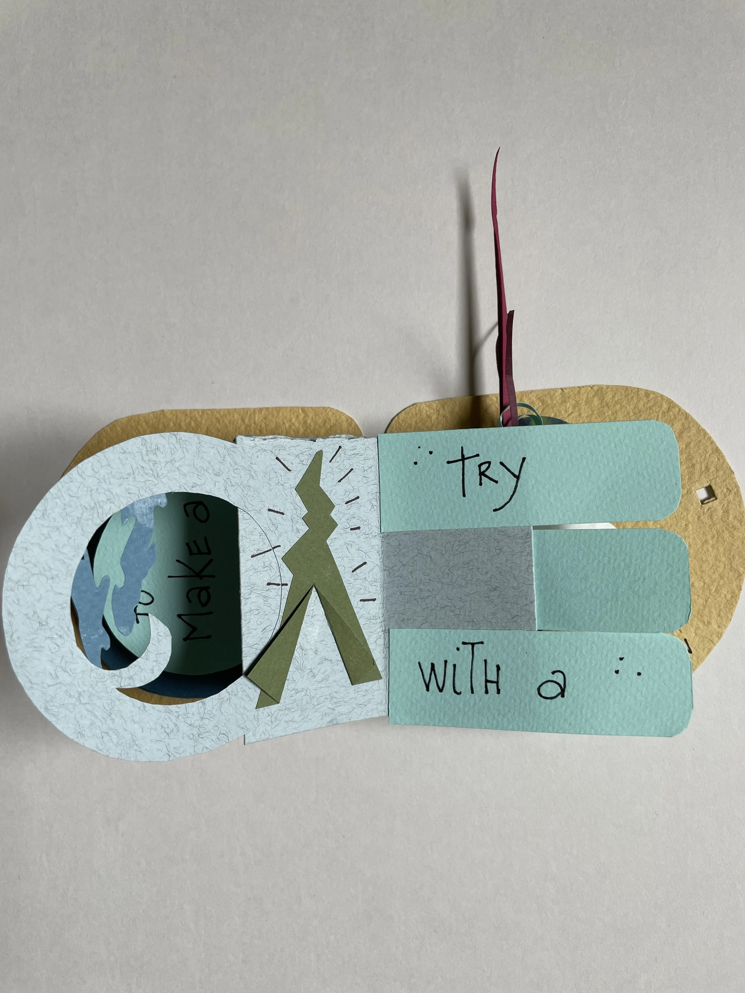 A handmade paper craft with a cut-out earth, telescope, and a note that says 'Let's try to make a difference with a'.