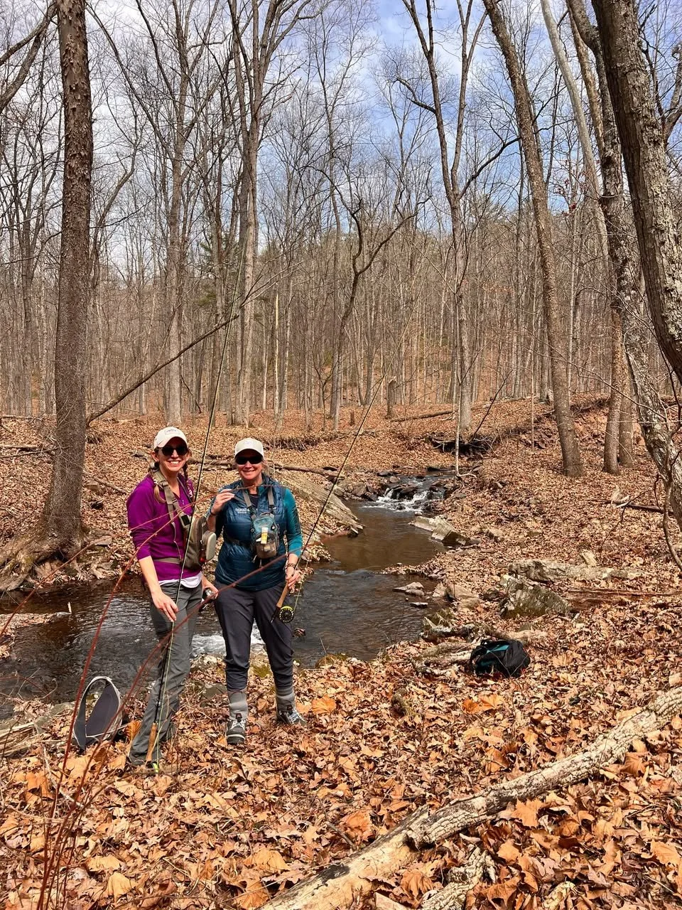 Women fishing at the spring 2025 retreat.