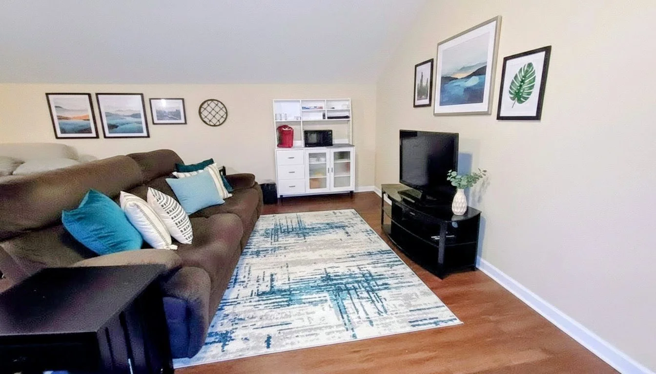 Living space with full size electric lounger couch.