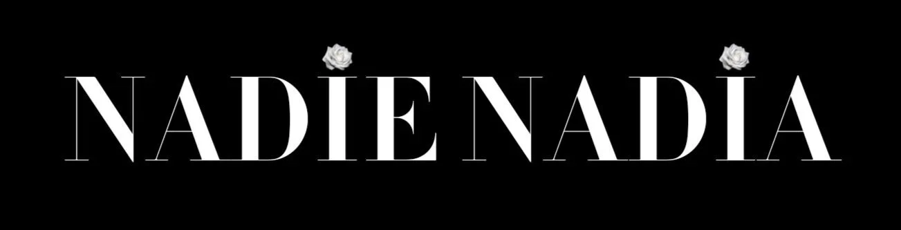 The NADIE NADIA logo with two white roses uses as the dot accents on the letter "i"