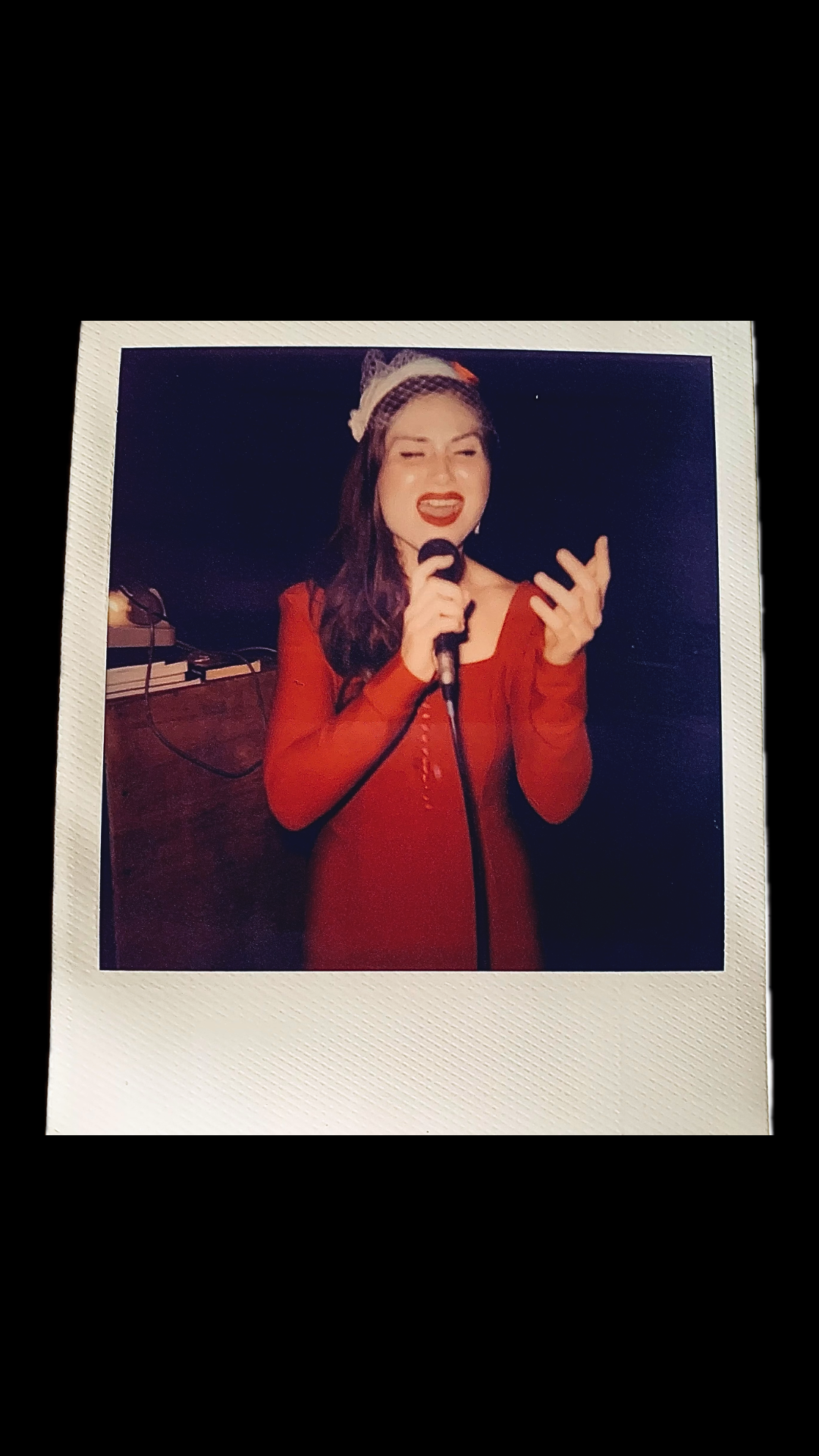 Polaroid of NADIE NADIA vocalist at a performance.