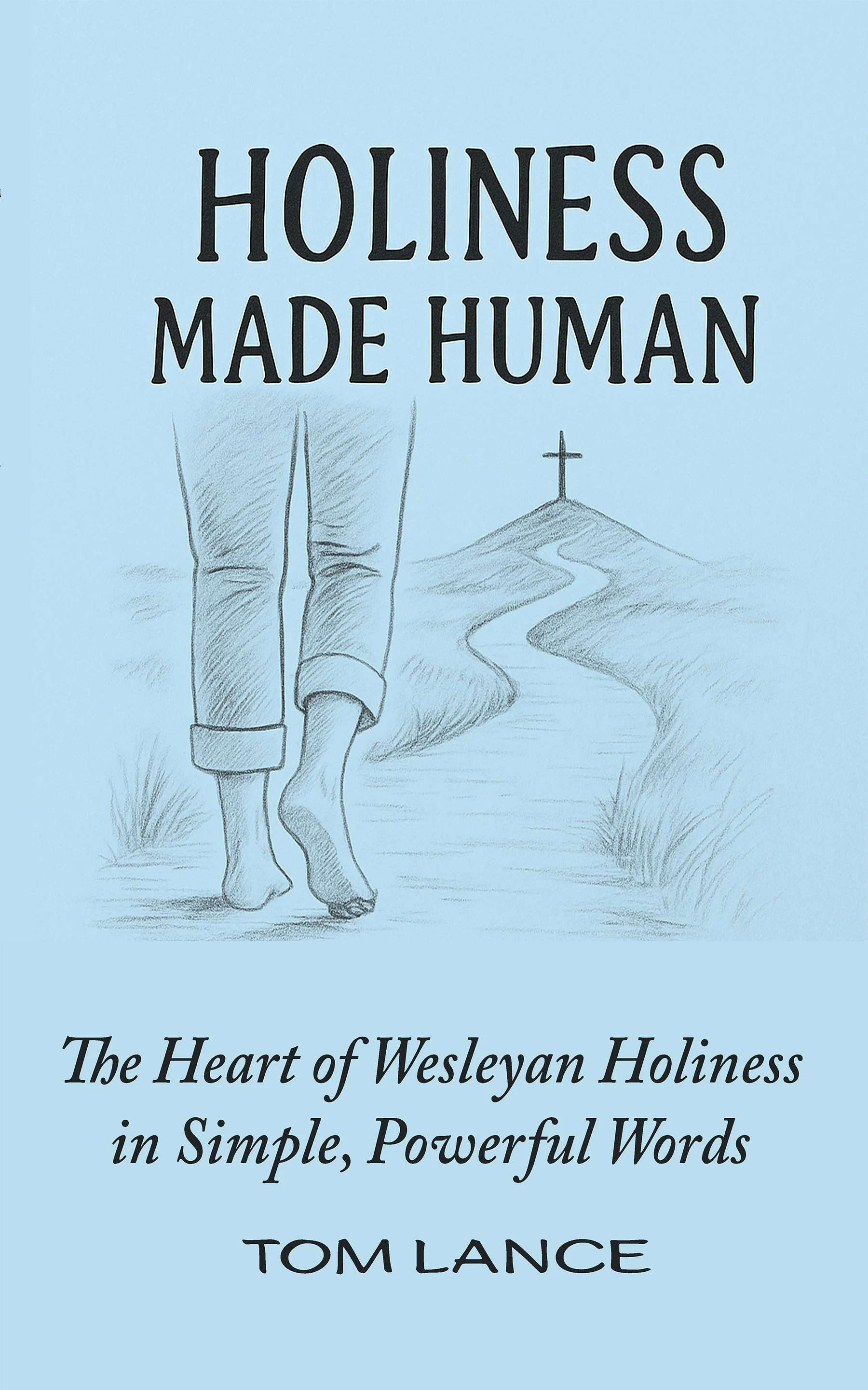 Book cover titled 'Holiness Made Human' with a drawing of a person walking on a path toward a cross on a hill, set against a blue background.