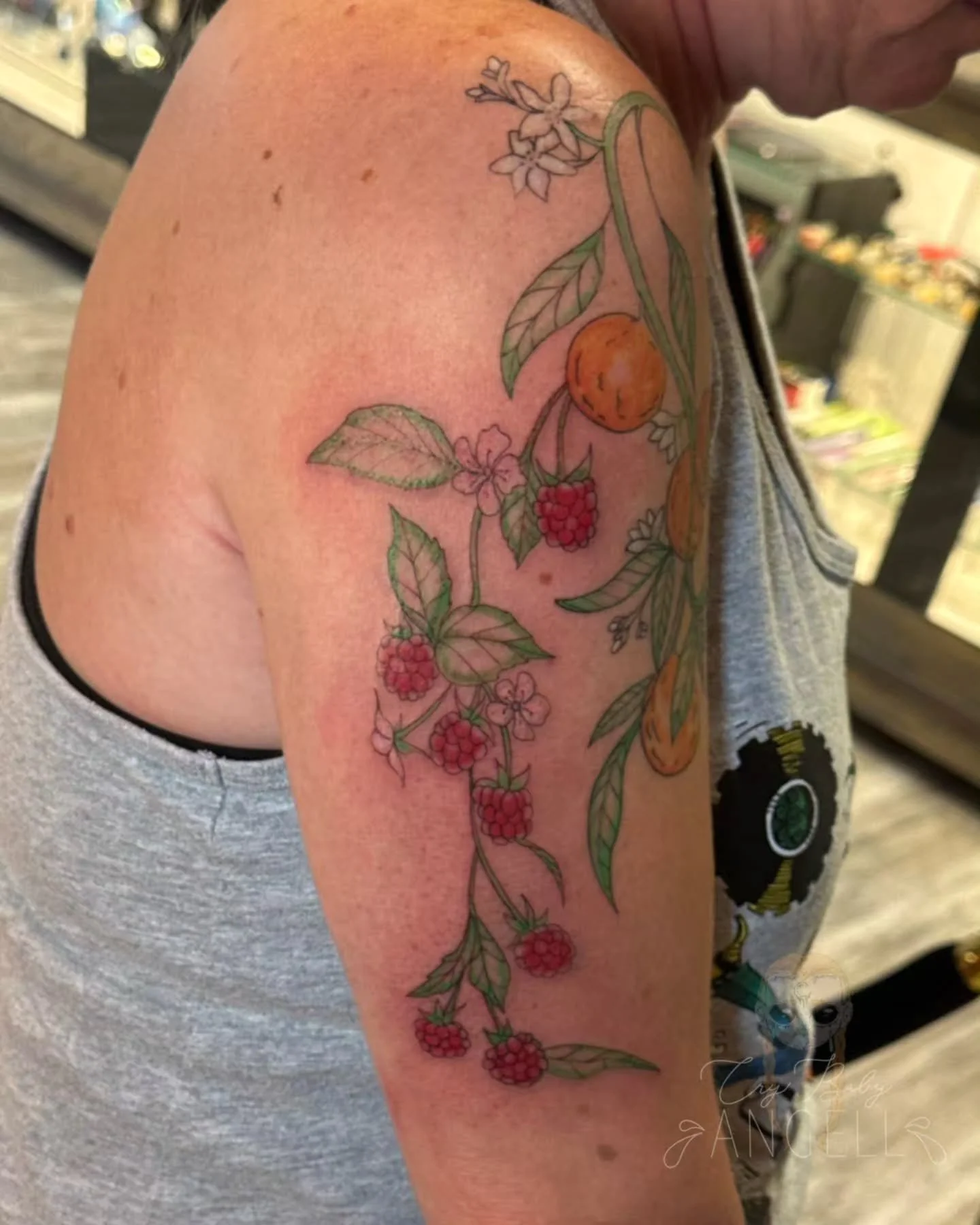 Working on a cute fruit sleeve for Jeri! Isn't it so cute? We just added Rasberries. The oranges are all healed. Cannot wait to add more to this! 

Hi, I'm Angell, I'm a tattoo artist in Aurora, Colorado at @deadlettertattoo I also guest spot in Para