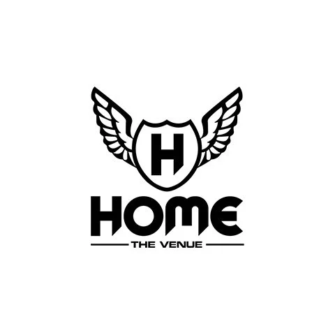 Logo with a shield and wings above the word 'HOME' and the phrase 'THE VENUE' beneath.