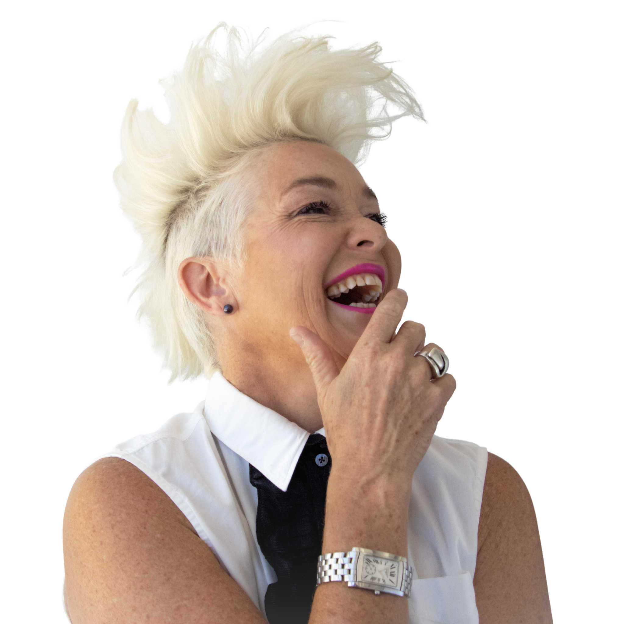 Close-up of a DJ Kate Monroe laughing with platinum blonde hair, wearing a white outfit, a black bow tie, a silver watch, and a ring on her finger.