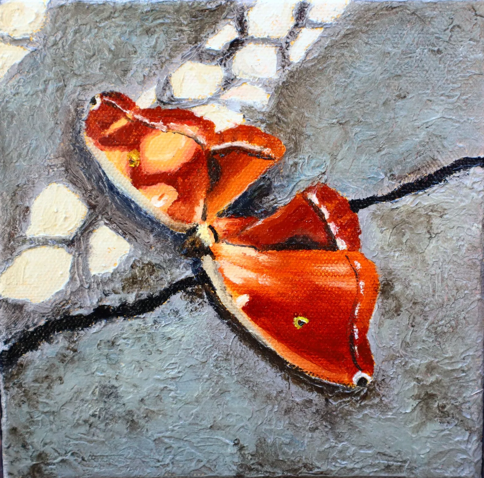 A painting of an orange butterfly on the sidewalk with a pattern of light on the right wing and ground.