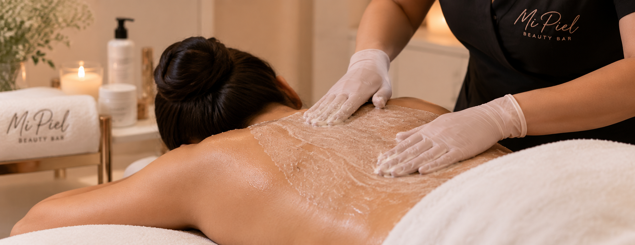 Client receiving a professional back facial treatment at Mi Piel Beauty Bar in Beltsville, MD.