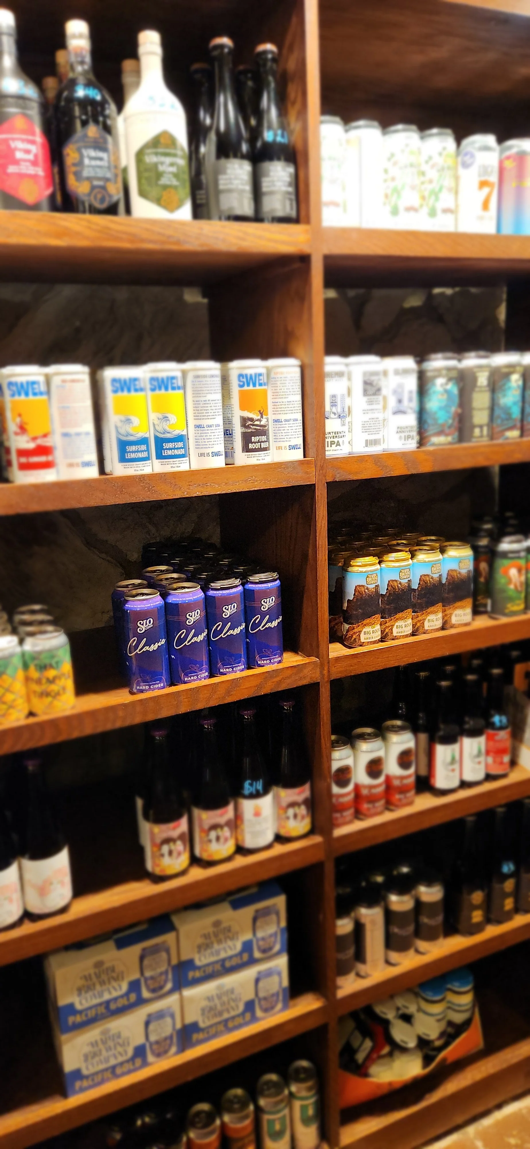 Bottles of beer, wine, cider and mead to go on a shelf at the good life in solvang