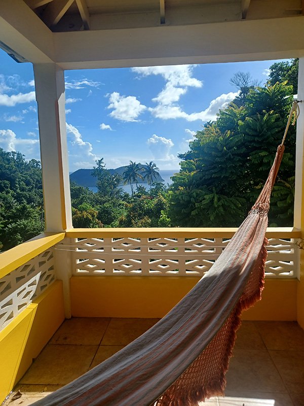 View towards the ocean from the balcony of the Ocean View Studio at Mango Garden Cottages in the north of Dominica. From here you can see the Cabrits National Park on the northern end of Prince Rupert Bay.