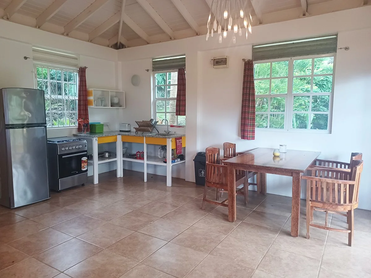 This is the open plan kitchen and dining area in the Ocean View Studio at Mango Garden Cottages. Fully equipped for self-catering, we can also tell you where the best markets are so you can enjoy Dominica's incredible fresh produce.