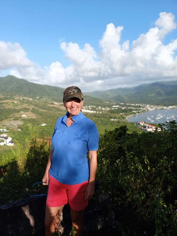 A happy guest half way through a hike through the Cabrits