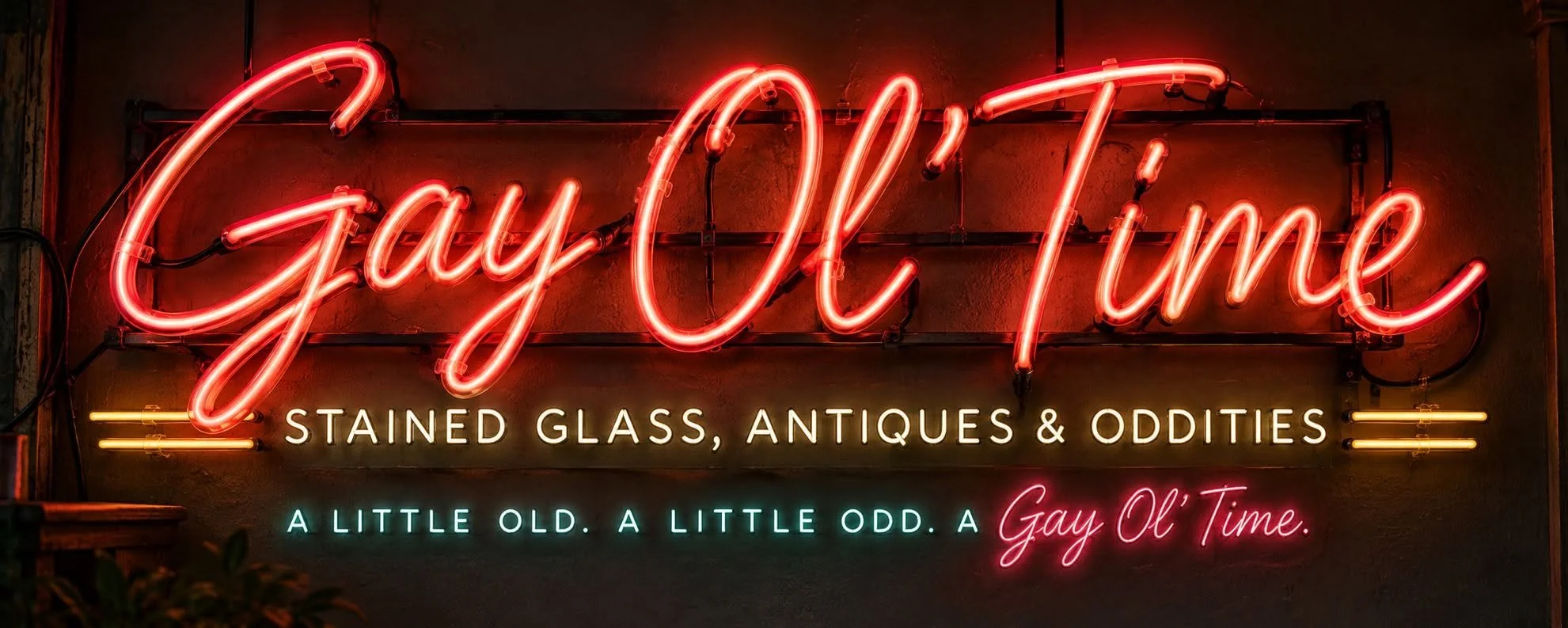 Neon sign reading 'Gay Ol' Time' with additional text 'Stained glass, antiques & oddities' and the tagline 'A little old. A little odd. A Gay Ol' Time.'