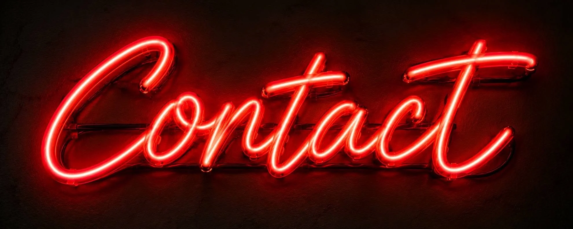 Neon sign spelling 'Contact' in red lights on a dark background.