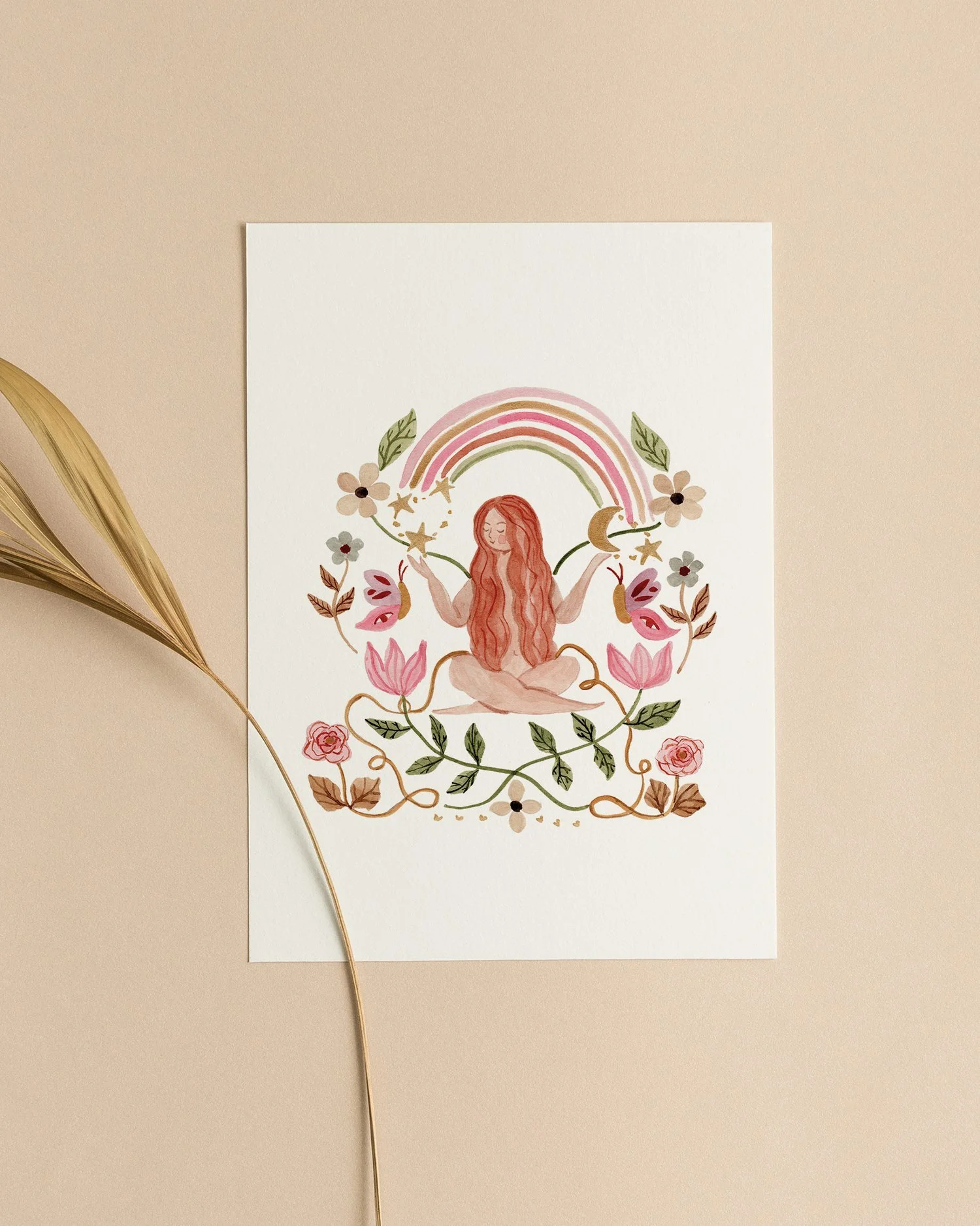 A watercolor illustration of a woman meditating with a rainbow, flowers, stars, a moon, and leaves around her, all in soft pastel colors.