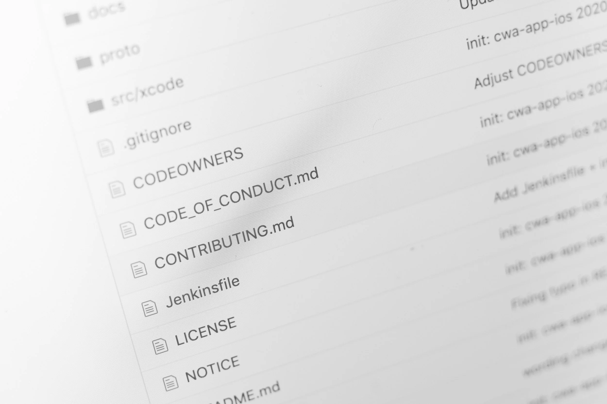 Screenshot of a computer screen showing a list of file folders and documents in a file directory, with some folders named 'proto', 'src/excode', 'gitignore', and documents with names like 'CODE_OF_CONDUCT.md' and 'LICENSE'.