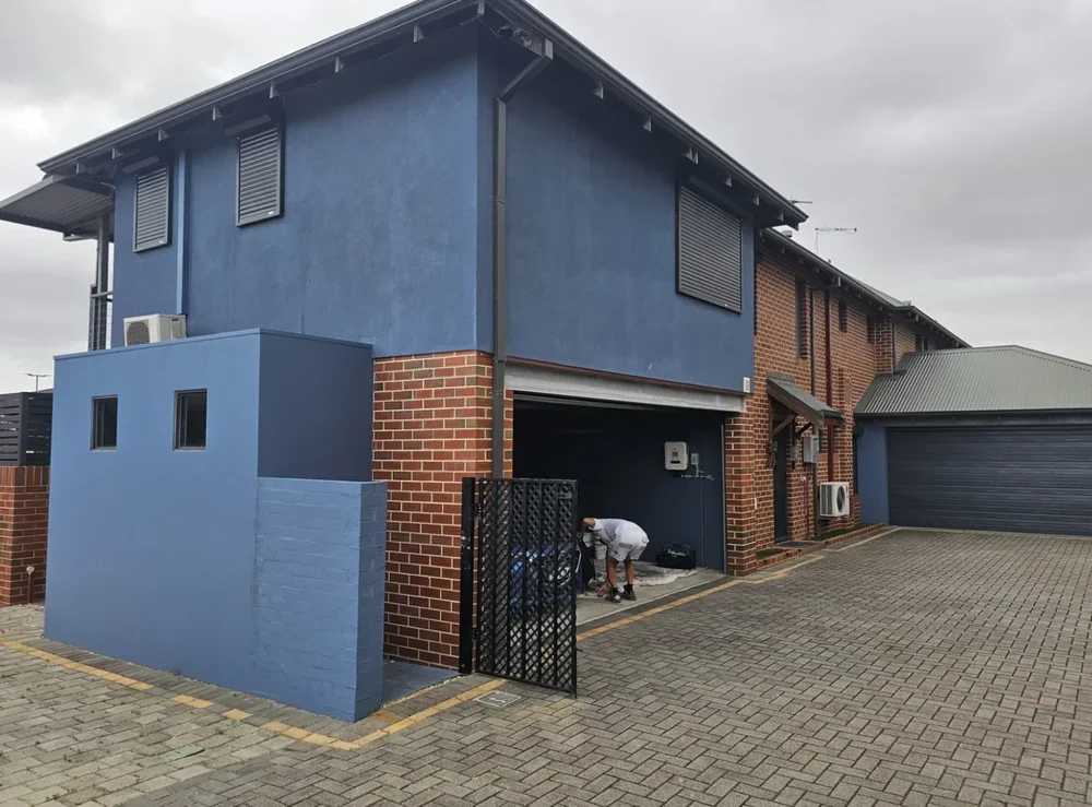 The same two-storey home before its exterior repaint