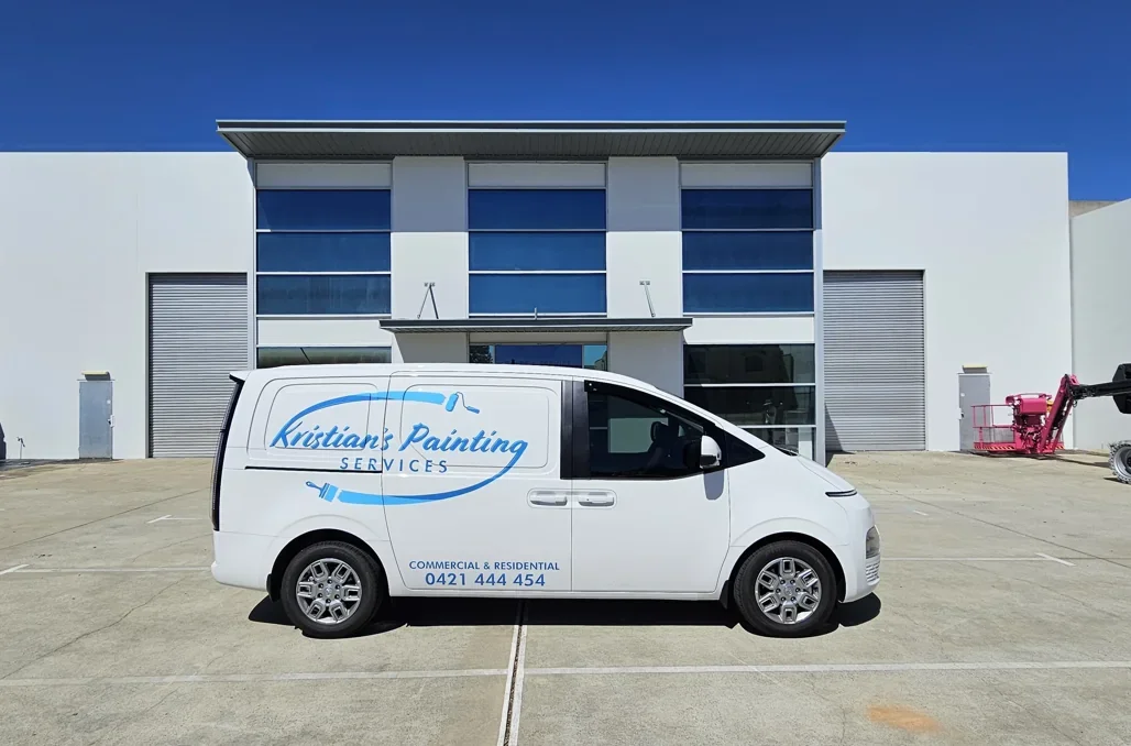 After: A commercial facade refreshed with contrasting blue and light panels.