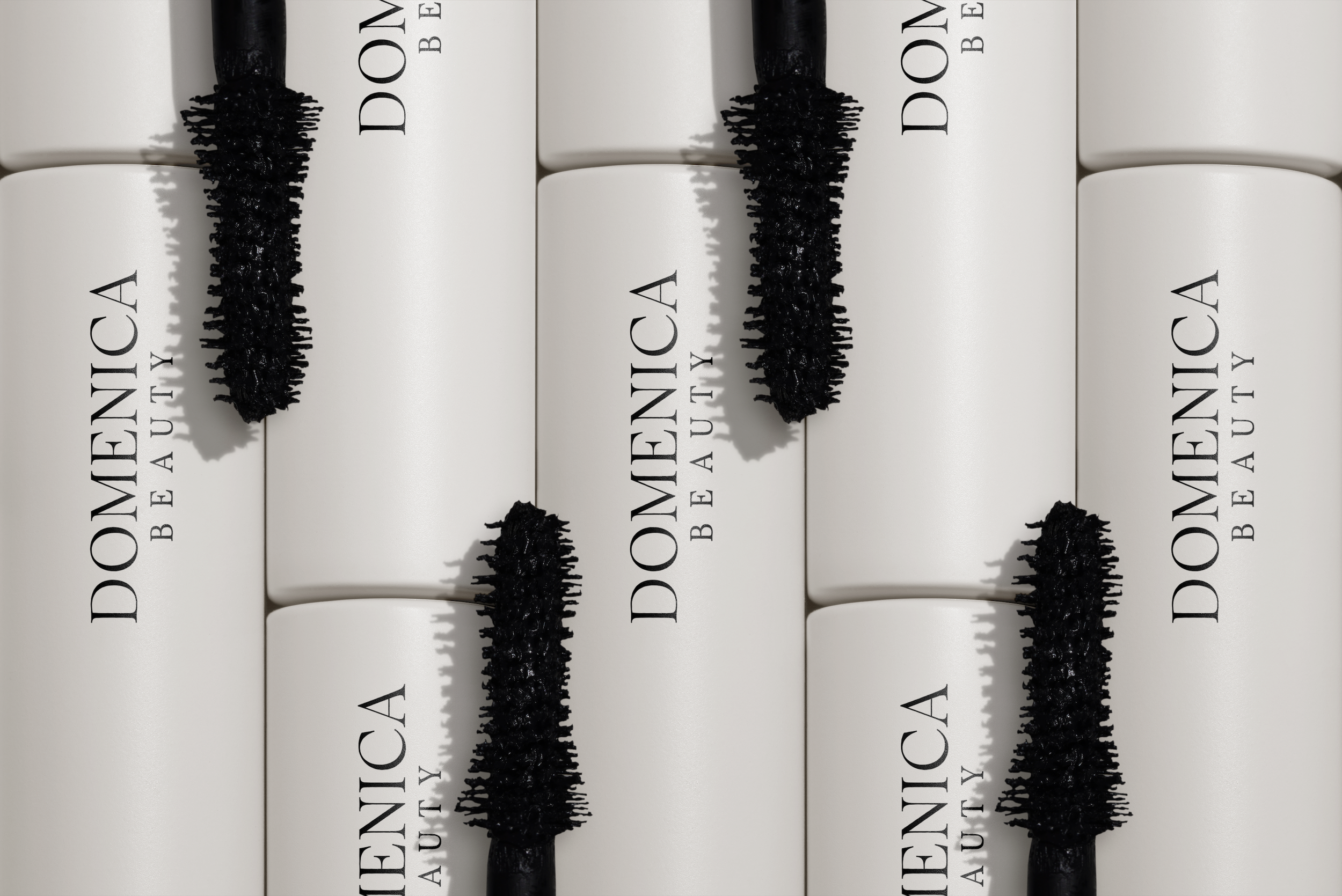 Domenica Beauty custom hair extension packaging and accessories displayed in the studio.