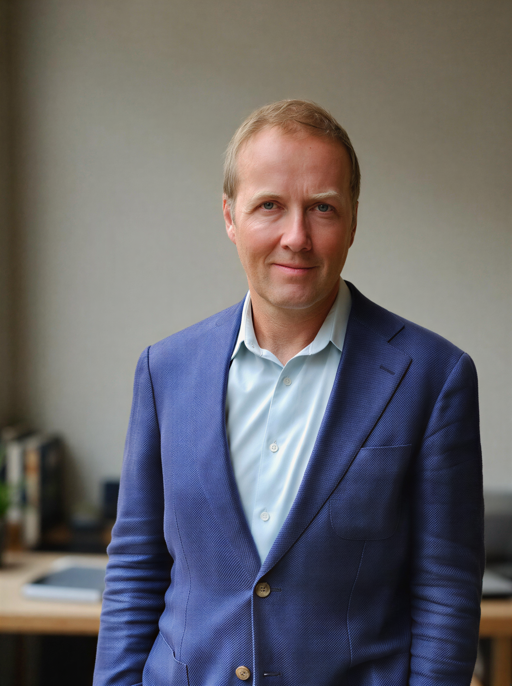 James Fenner, founder of Gryphon Advisory, standing in a professional office setting.
