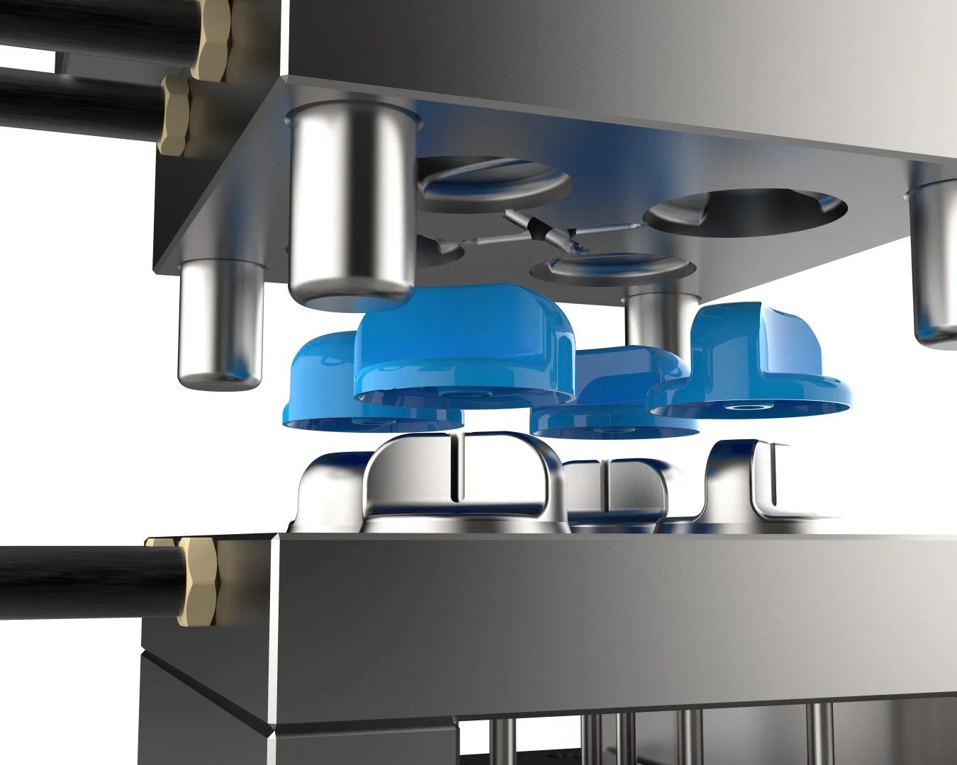 Close-up of an industrial machine with blue and metallic components, featuring circular molds and cylindrical parts, likely used for manufacturing or assembly processes.