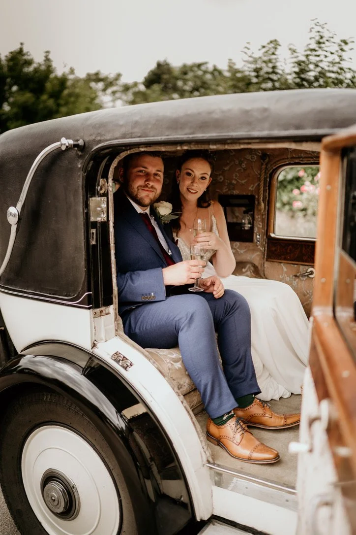 Claire Field Bridal Hairstylist and Makeup artist, Bride and Groom in their car.